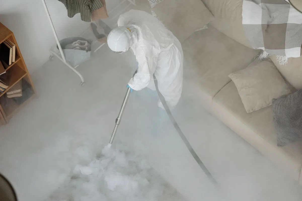Biohazard cleanup technician in protective equipment, Roslindale, Boston, MA